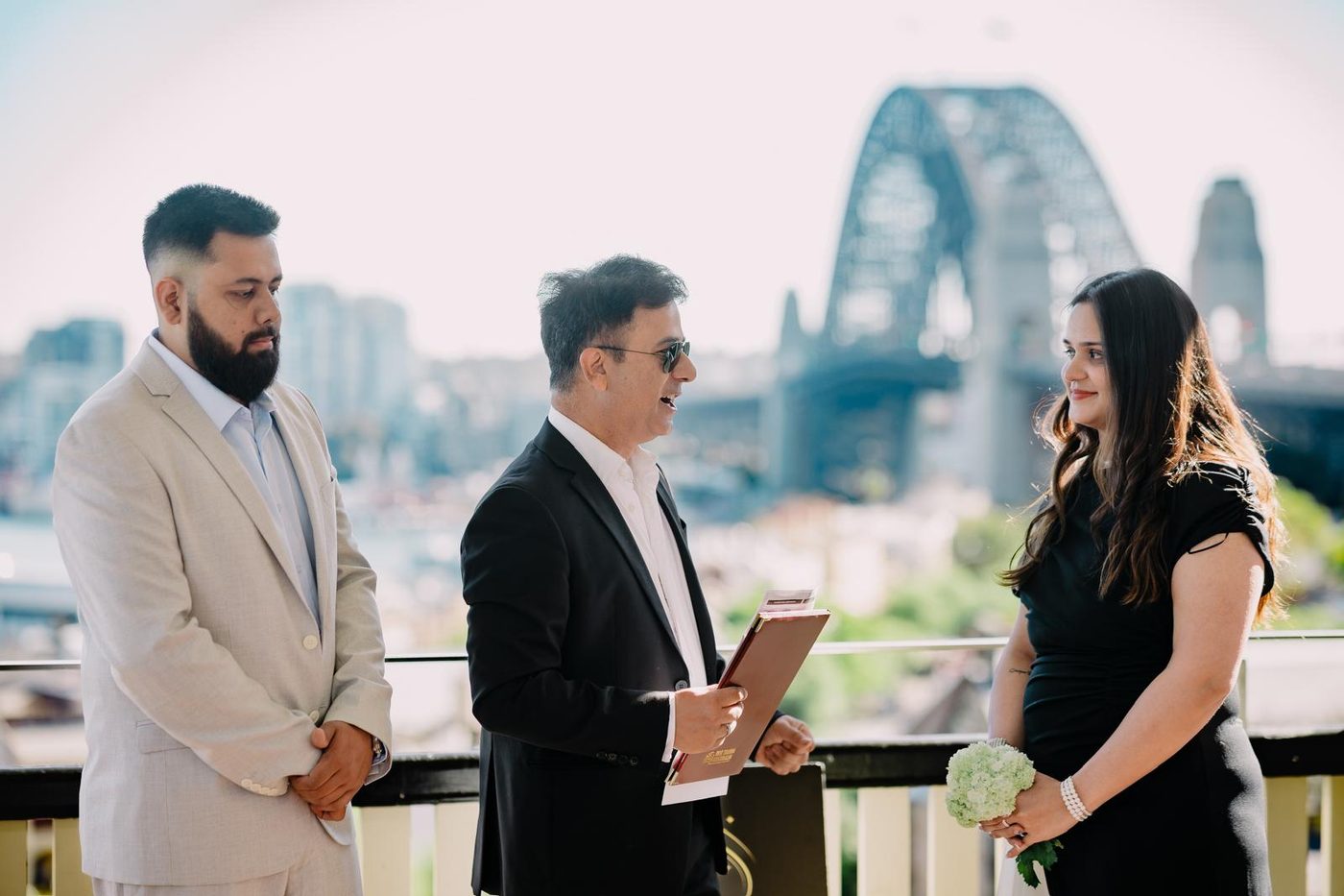 Couple exchanging vows overlooking Sydney Harbour