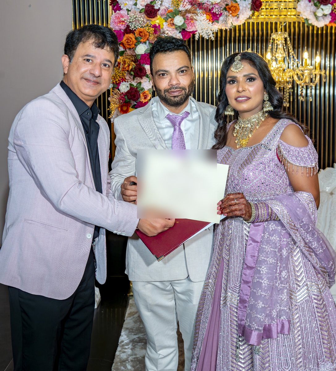 Star Celebrant presenting the marriage certificate to an Indian-Australian couple in Sydney